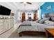 Open concept main bedroom, featuring natural light and hardwood floors at 13424 Hunters Point St, Spring Hill, FL 34609