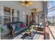 Relaxing patio featuring comfortable seating, ceiling fans, a hammock and access to the pool at 13424 Hunters Point St, Spring Hill, FL 34609