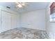 Bright bedroom featuring a closet, awaiting transformation with renovation opportunities at 13908 Paradise Ln, Dade City, FL 33525