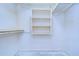Walk-in closet featuring ample storage space at 13908 Paradise Ln, Dade City, FL 33525