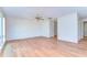 Bright living room with hardwood floors and a ceiling fan at 13908 Paradise Ln, Dade City, FL 33525