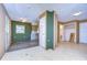 Expansive living area with open floor plan and access to the kitchen and bath offering renovation potential at 13908 Paradise Ln, Dade City, FL 33525