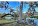 Stunning view of a lake and mature trees at 13908 Paradise Ln, Dade City, FL 33525