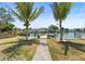 Gorgeous waterfront view with a private dock and lush landscaping perfect for enjoying the waterfront lifestyle at 14184 W Parsley Dr, Madeira Beach, FL 33708