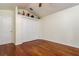 Bedroom featuring hardwood floors, a closet with white doors, and neutral walls at 17104 Tiffany Lake Pl, Lutz, FL 33549