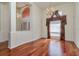 Dining room showcasing wood floors, chandelier, and bright natural light from the windows at 17104 Tiffany Lake Pl, Lutz, FL 33549