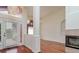 Bright foyer with wood flooring, chandelier, and view of the front doors and living space at 17104 Tiffany Lake Pl, Lutz, FL 33549