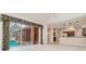 Spacious living room with sliding doors to the screened-in lanai and open to the kitchen at 17104 Tiffany Lake Pl, Lutz, FL 33549