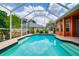Beautiful backyard pool with screened enclosure and easy access to the home at 17104 Tiffany Lake Pl, Lutz, FL 33549