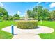 Beautiful park-like setting with manicured gardens, a statue, and lush landscaping at 2434 Australia E Way # 8, Clearwater, FL 33763