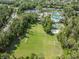 Extensive community amenties from an aerial view: field, basketball and volleyball courts, and a pool at 26900 Juniper Bay Dr, Wesley Chapel, FL 33544