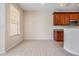 Inviting kitchen space featuring warm wood cabinetry, stainless steel appliances, and a breakfast bar area at 26900 Juniper Bay Dr, Wesley Chapel, FL 33544