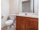 Half bath featuring a vanity with wood cabinet and tile floors at 26932 Juniper Bay Dr, Wesley Chapel, FL 33544