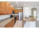 Beautiful kitchen featuring granite countertops, stainless steel appliances, and ample cabinet space at 26932 Juniper Bay Dr, Wesley Chapel, FL 33544