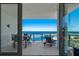 Relax on your private balcony with ocean views and space for seating, accessible through sliding glass doors at 301 1St Street S # 1901, St Petersburg, FL 33701