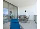 Spacious balcony featuring a dining set and lounge chair, offering an ideal outdoor living space at 301 1St Street S # 1901, St Petersburg, FL 33701