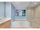 Modern bathroom with a soaking tub, glass-enclosed shower, and sleek vanity at 301 1St Street S # 1901, St Petersburg, FL 33701
