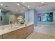 Contemporary bathroom with double sinks, modern vanity, soaking tub, and a glass shower enclosure at 301 1St Street S # 1901, St Petersburg, FL 33701
