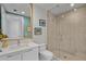 Bright bathroom showcases a sleek vanity and frameless glass shower, creating a modern and functional space at 301 1St Street S # 1901, St Petersburg, FL 33701
