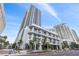 Modern high-rise building exterior with curved balconies and lush landscaping at 301 1St Street S # 1901, St Petersburg, FL 33701