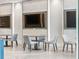 Comfortable common room with tables, chairs, and mounted TVs for shared entertainment at 301 1St Street S # 1901, St Petersburg, FL 33701