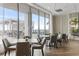 Cozy dining area with modern chairs, tables, and an outdoor view at 301 1St Street S # 1901, St Petersburg, FL 33701