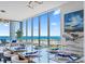 Dining area featuring a modern table setting, sleek decor, and expansive windows offering stunning ocean views at 301 1St Street S # 1901, St Petersburg, FL 33701