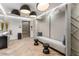 A hallway with wood floors, indirect lighting, and built in bench creates a welcoming and modern entrance at 301 1St Street S # 1901, St Petersburg, FL 33701