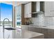 Modern kitchen featuring stainless steel appliances, sleek cabinetry, and elegant backsplash tiles for a contemporary look at 301 1St Street S # 1901, St Petersburg, FL 33701