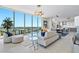 Beautifully designed living room with floor to ceiling windows, connecting to a modern open kitchen, filled with natural light at 301 1St Street S # 1901, St Petersburg, FL 33701
