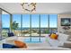 Bright, modern living room with floor-to-ceiling windows offering incredible views and stylish contemporary decor at 301 1St Street S # 1901, St Petersburg, FL 33701