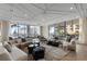 Inviting lounge space with comfortable sofas, unique tables, and access to an outdoor patio at 301 1St Street S # 1901, St Petersburg, FL 33701