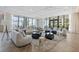 Bright lounge area with floor-to-ceiling windows, modern seating, and unique ceiling design at 301 1St Street S # 1901, St Petersburg, FL 33701