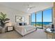 Calm main bedroom featuring walls of glass with ocean views, neutral colors, and comfortable seating at 301 1St Street S # 1901, St Petersburg, FL 33701