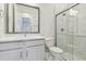 Bathroom featuring a glass shower, white marble, and a modern sink at 31430 Hayman Loop, Wesley Chapel, FL 33545