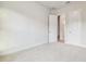 Bedroom featuring plush carpet and two doors at 31430 Hayman Loop, Wesley Chapel, FL 33545