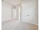 Bedroom featuring closet, ensuite bathroom, neutral walls and plush carpeting at 31430 Hayman Loop, Wesley Chapel, FL 33545