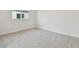 Clean, empty bedroom with neutral walls and carpet at 31430 Hayman Loop, Wesley Chapel, FL 33545