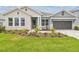 Beautiful home with a well-manicured lawn and appealing landscaping at 31430 Hayman Loop, Wesley Chapel, FL 33545