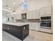 Gourmet kitchen with a central island, stainless steel appliances, and ample storage at 31430 Hayman Loop, Wesley Chapel, FL 33545