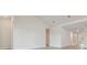Spacious living room with vaulted ceiling and wood-look floors at 31430 Hayman Loop, Wesley Chapel, FL 33545