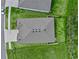 An aerial view of the single-Gathering home with a well manicured lawn and privacy fence at 3528 Golden Wheat Ln, Plant City, FL 33565
