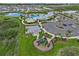 Aerial view of the community highlighting the playground, basketball court, parking area, and luxurious pool area at 3528 Golden Wheat Ln, Plant City, FL 33565
