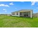 Charming single-story home featuring a spacious backyard with a screened patio and white fence at 3528 Golden Wheat Ln, Plant City, FL 33565
