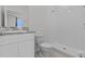 Clean bathroom featuring white vanity, toilet, and a walk-in shower at 3528 Golden Wheat Ln, Plant City, FL 33565