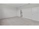 Bedroom with neutral carpet, tray ceiling, and access to bathroom with a shower and tub at 3528 Golden Wheat Ln, Plant City, FL 33565