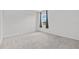 A bright bedroom with plush carpet, a window, and neutral walls at 3528 Golden Wheat Ln, Plant City, FL 33565