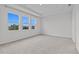 Bright bedroom features neutral carpet, tray ceiling, and three large windows offering great natural light at 3528 Golden Wheat Ln, Plant City, FL 33565