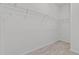 Walk-in closet features carpet, white walls, and plenty of metal shelving for organization at 3528 Golden Wheat Ln, Plant City, FL 33565