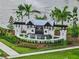 Elegant community entrance with lush landscaping and a decorative water feature at 3528 Golden Wheat Ln, Plant City, FL 33565